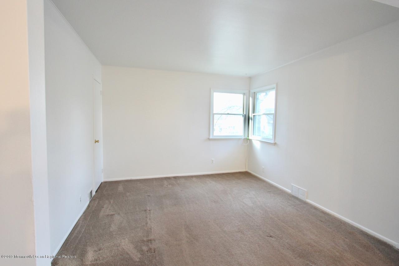 412 Ely Road Neptune Township, NJ 07753 - Photo 5 of 15 an empty room with windows