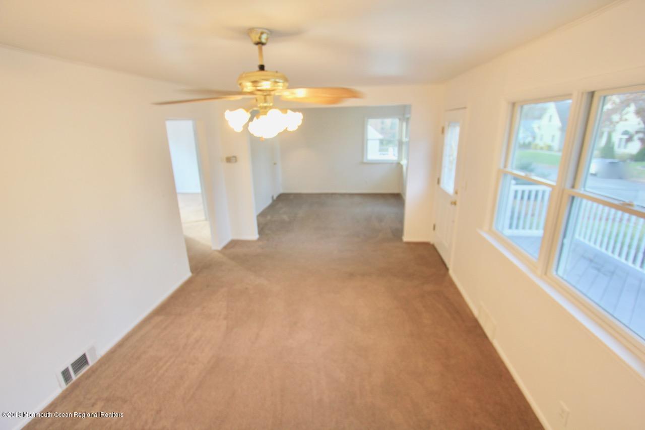 412 Ely Road Neptune Township, NJ 07753 - Photo 7 of 15 a view of a livingroom with a chandelier