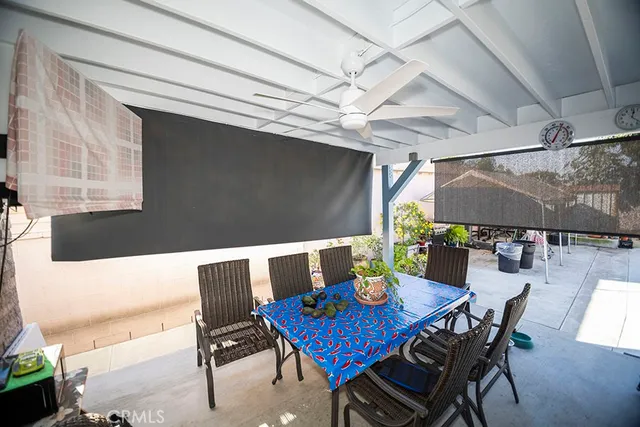 a view of a dining table and chairs in the patio