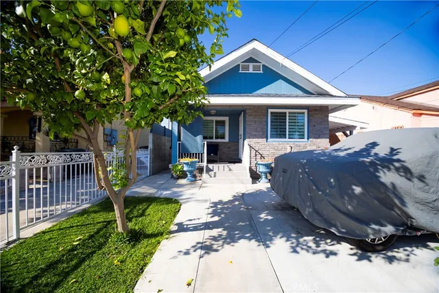 a front view of a house with garden