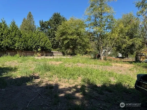 a view of outdoor space with deck and yard
