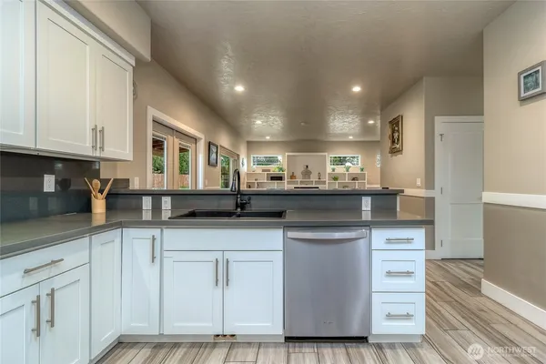 a kitchen with a refrigerator and cabinets