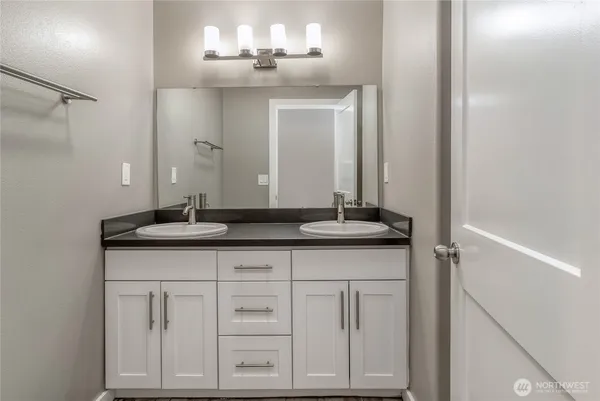 a view of a bathroom from the hallway