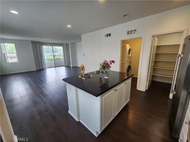a kitchen with sink and cabinets