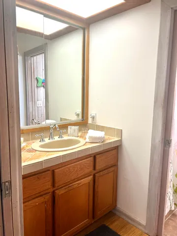 a bathroom with a sink and a mirror