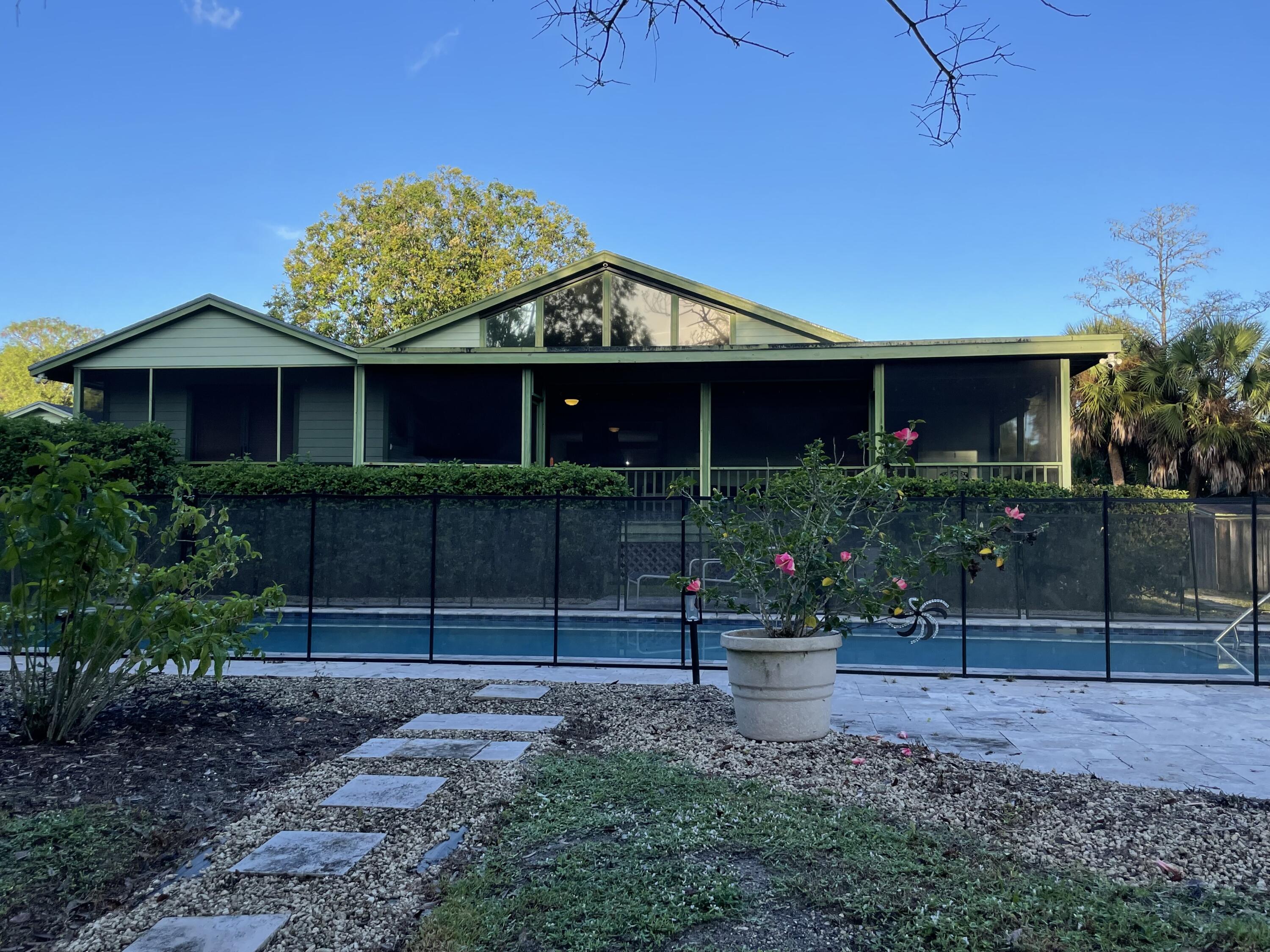 17534 103rd Terrace North Jupiter, FL 33478 - Photo 20 of 25 a view of a house with a garden