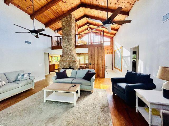 17534 103rd Terrace North Jupiter, FL 33478 - Photo 6 of 25 a living room with furniture a fireplace and a table