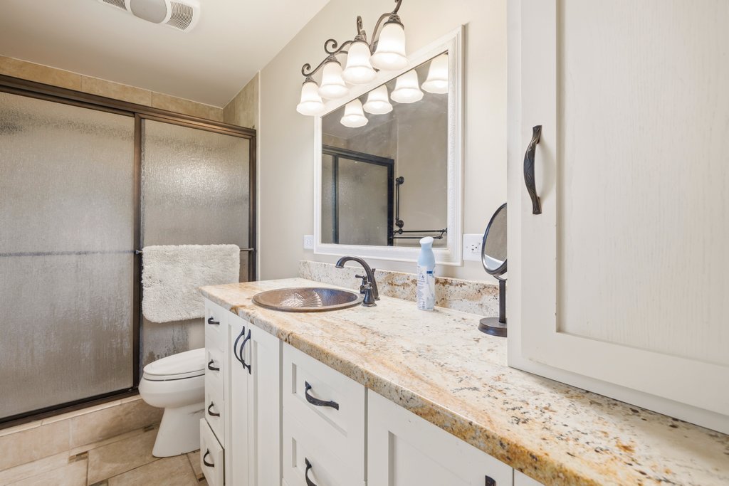 1961 Bolton Road Marion, TX 78124 - Photo 13 of 17 a bathroom with a granite countertop sink toilet and shower