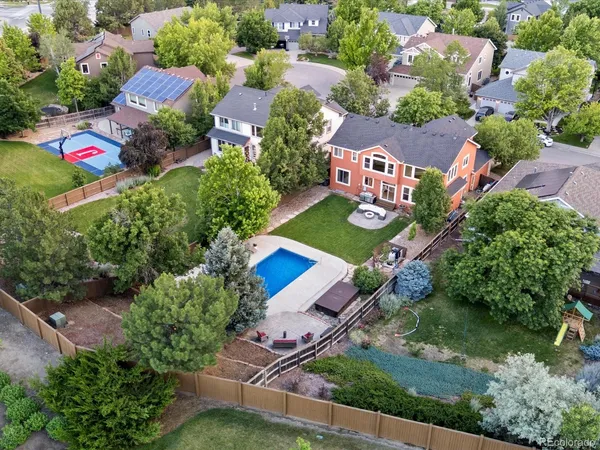 an aerial view of house with yard swimming pool and outdoor seating