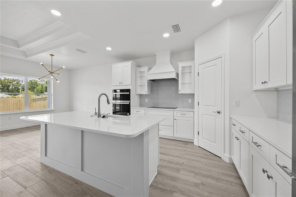 6702 Southwest 10th Lane Gainesville, FL 32607 - Photo 10 of 28 a kitchen with cabinets and window