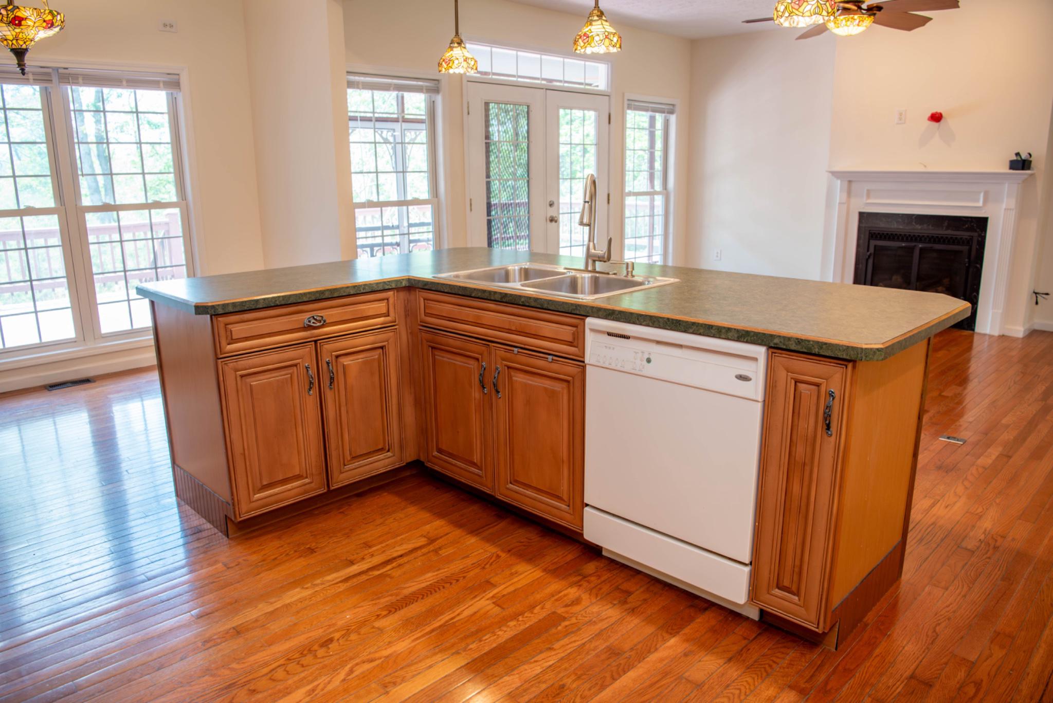 792 Forest Glen Road Moorefield, WV 26836 - Photo 28 of 146 Inviting kitchen/living room with warm wood tones.