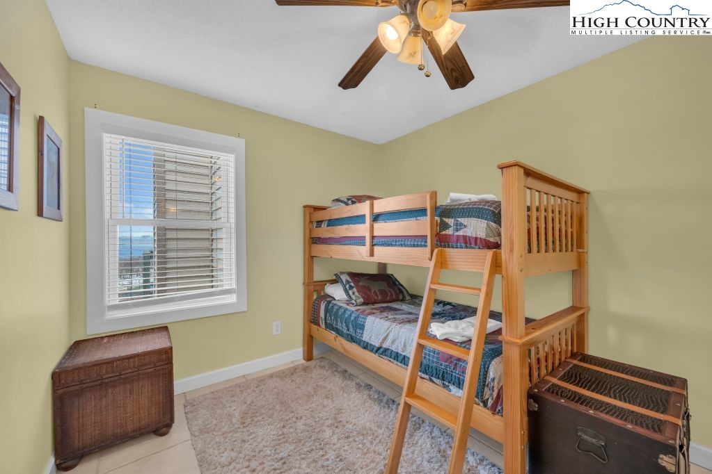301 Pinnacle Inn Road, Unit 4314 Beech Mountain, NC 28604 - Photo 16 of 39 a bedroom with a bunk bed and a window