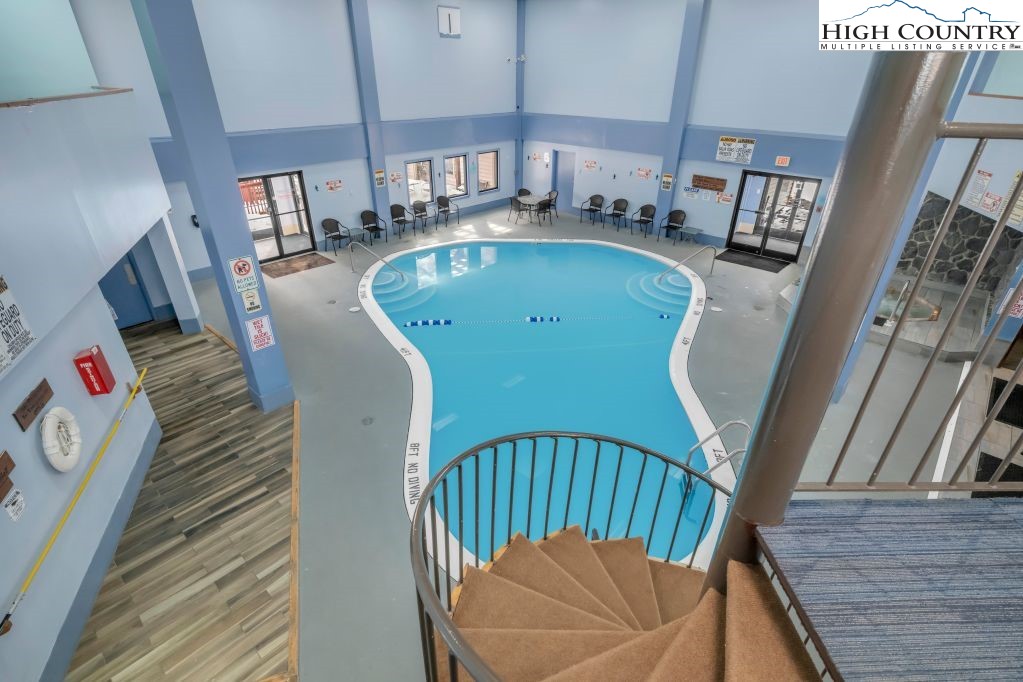 301 Pinnacle Inn Road, Unit 4314 Beech Mountain, NC 28604 - Photo 32 of 39 a view of entryway and kitchen with wooden floor