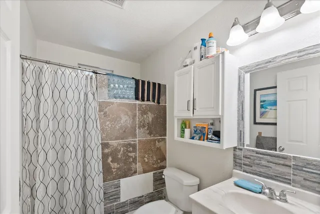 a view of a bathroom with a sink and a window