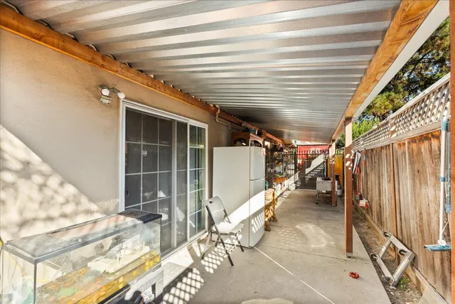 a view of a backyard with plants and a patio