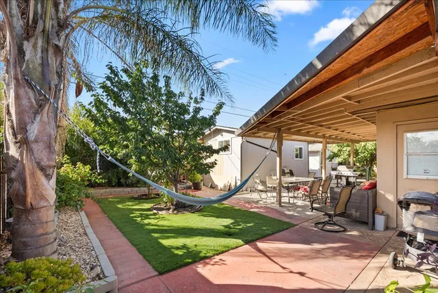 a view of a backyard with sitting area