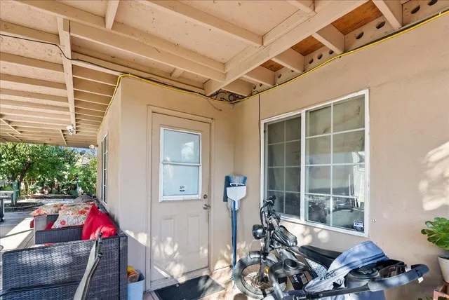 a bedroom with furniture and a flat screen tv