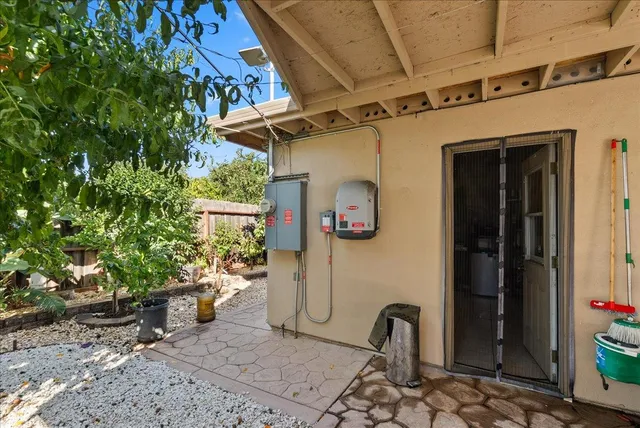 a view of walk in closet with clothes