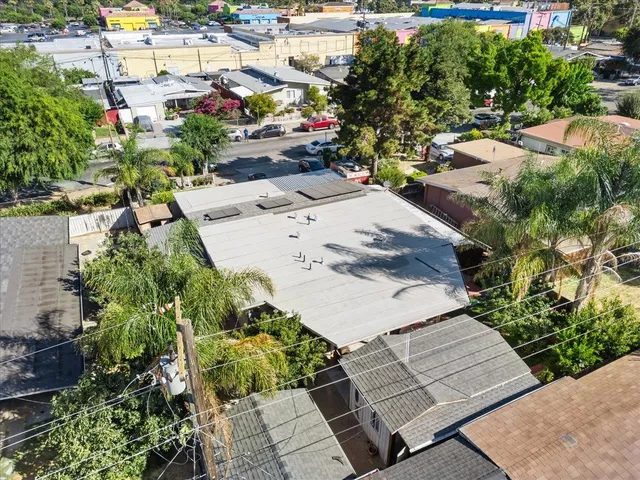 an aerial view of a house with a yard