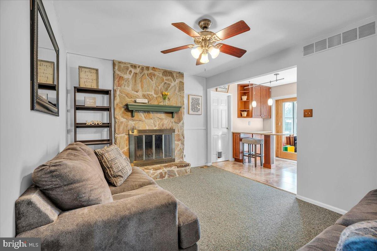 20 Longhurst Road Marlton, NJ 08053 - Photo 11 of 28 Cozy living space with stone fireplace charm.
