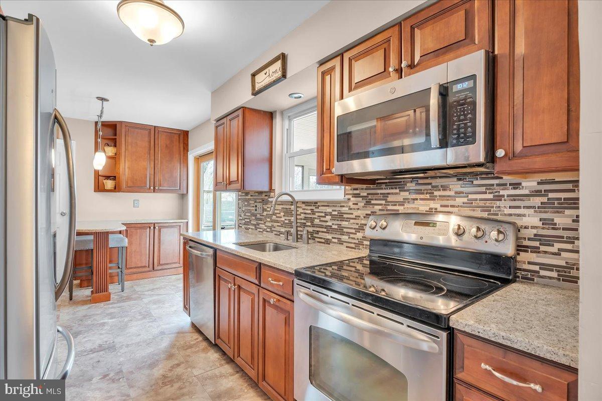 20 Longhurst Road Marlton, NJ 08053 - Photo 8 of 28 Modern kitchen with rich wood cabinetry.