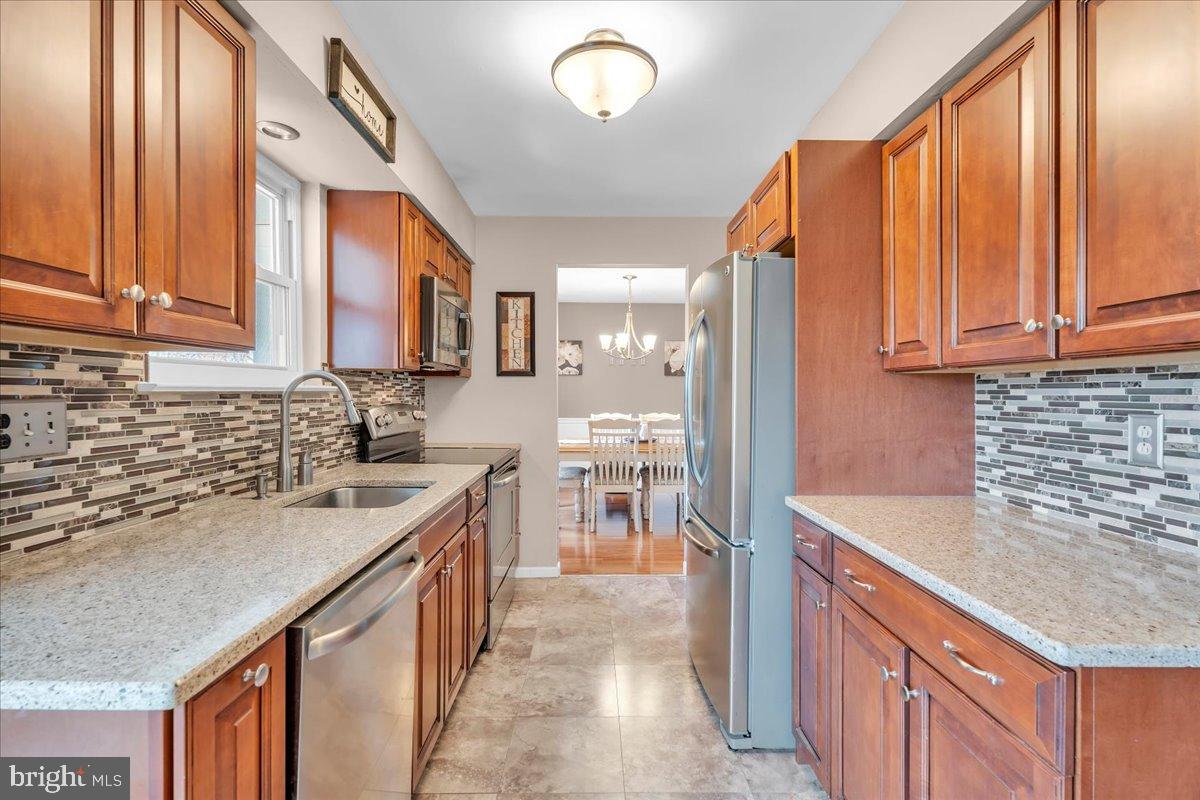 20 Longhurst Road Marlton, NJ 08053 - Photo 9 of 28 Modern kitchen with rich wood cabinetry.