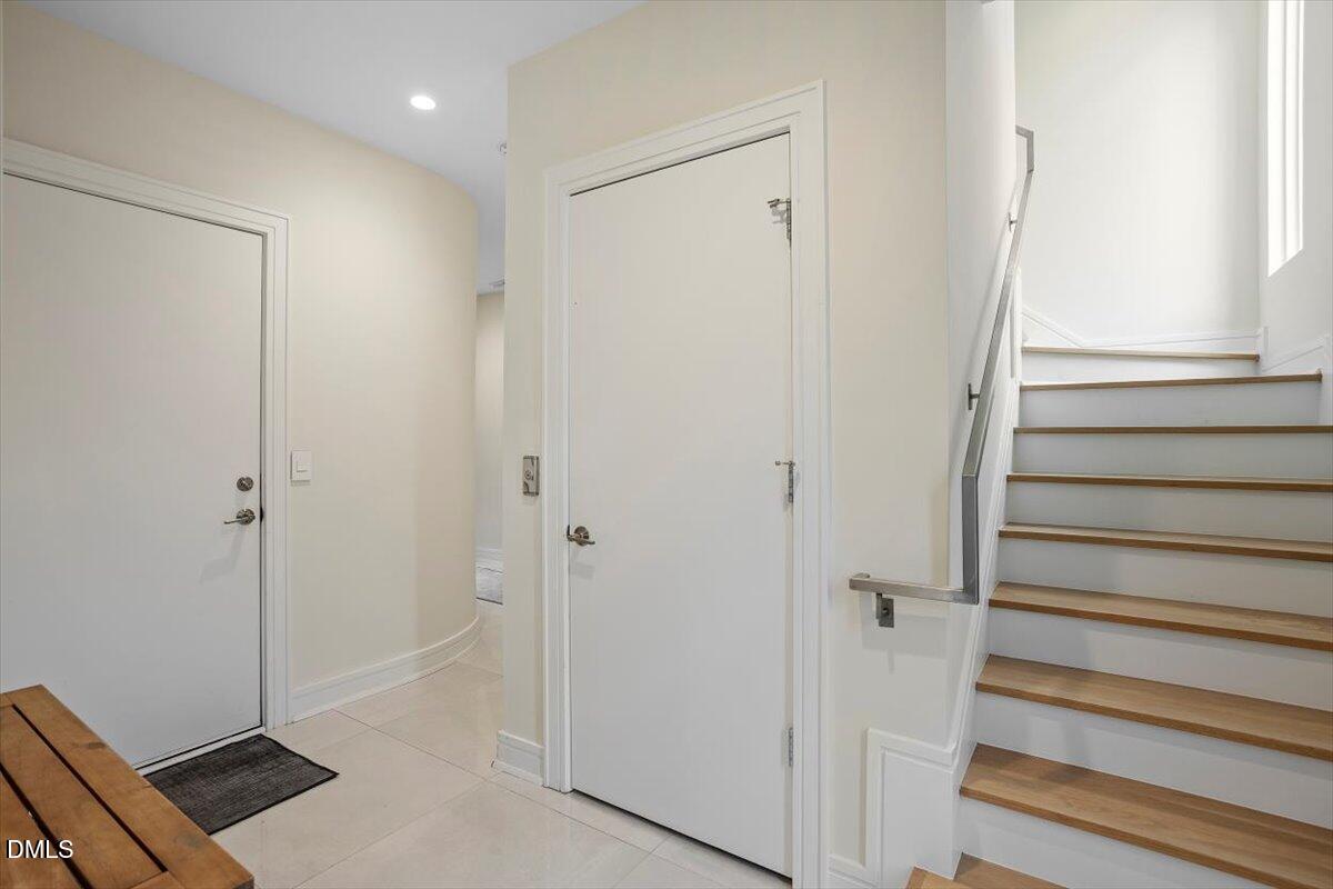 206 Dundas Lane Raleigh, NC 27603 - Photo 11 of 30 a view of front door with wooden floor and closet