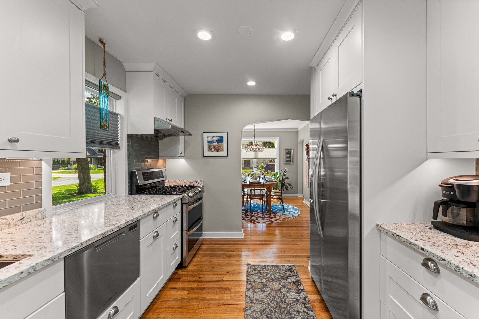 725 North County Line Road Hinsdale, IL 60521 - Photo 2 of 34 a large kitchen with stainless steel appliances granite countertop a lot of counter top space and wooden floor