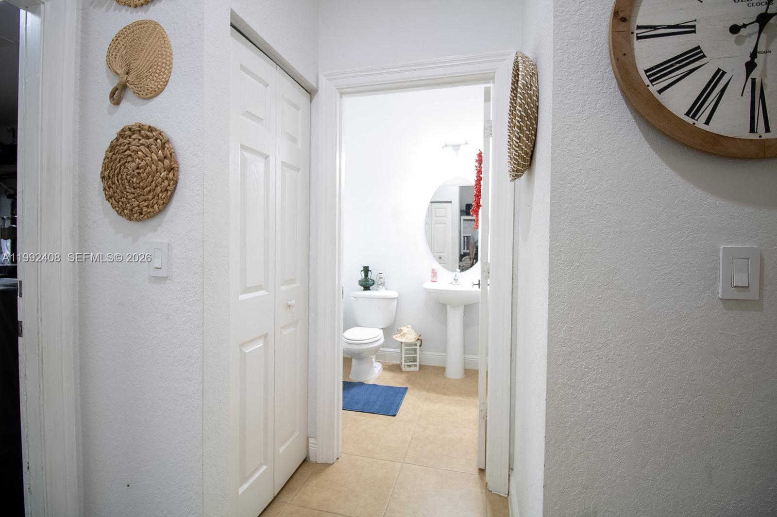 2607 Southwest 99th Way Miramar, FL 33025 - Photo 15 of 50 a bathroom with a toilet and a view of bathroom