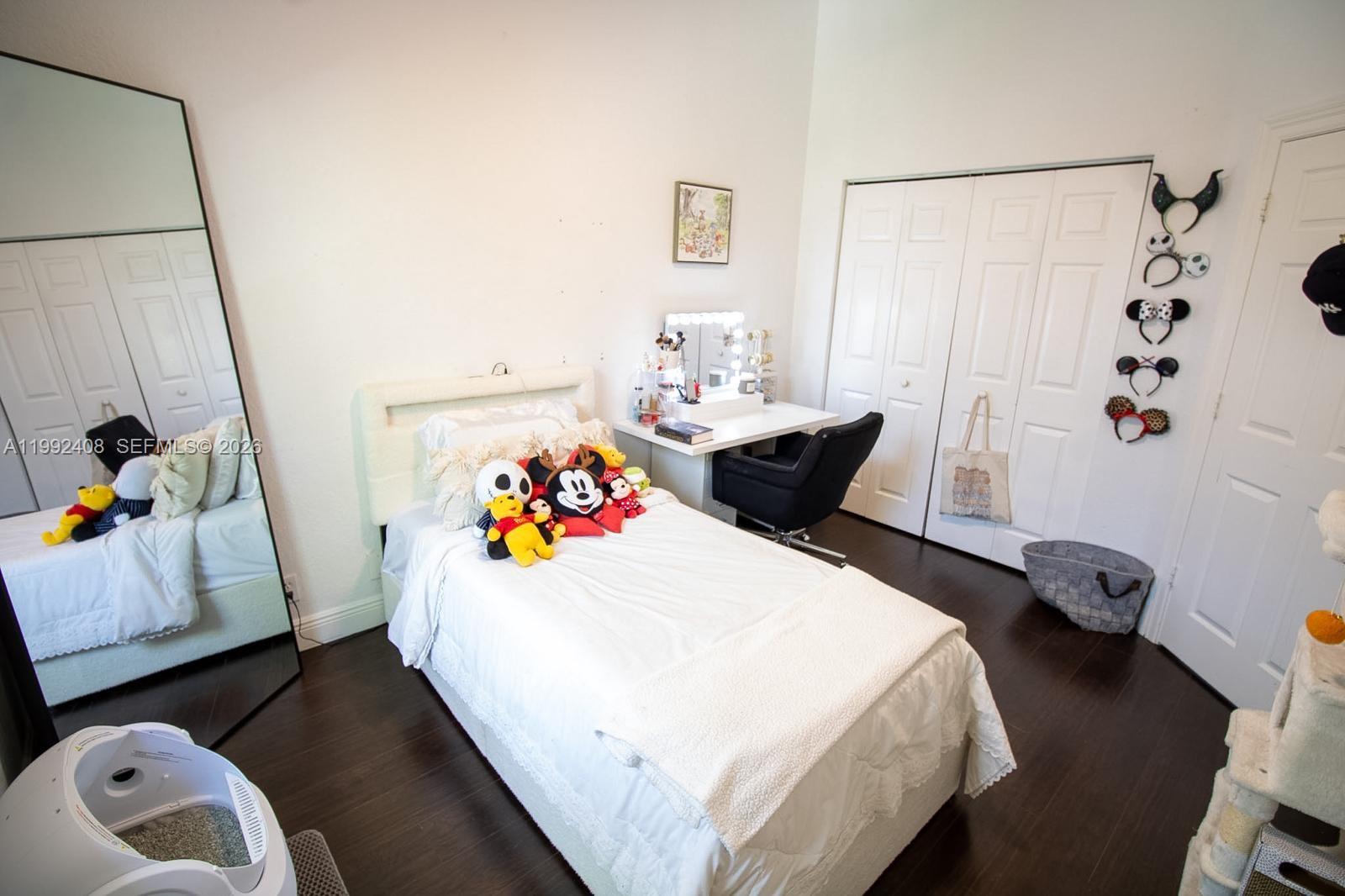 2607 Southwest 99th Way Miramar, FL 33025 - Photo 23 of 50 a bedroom with a bed and a window