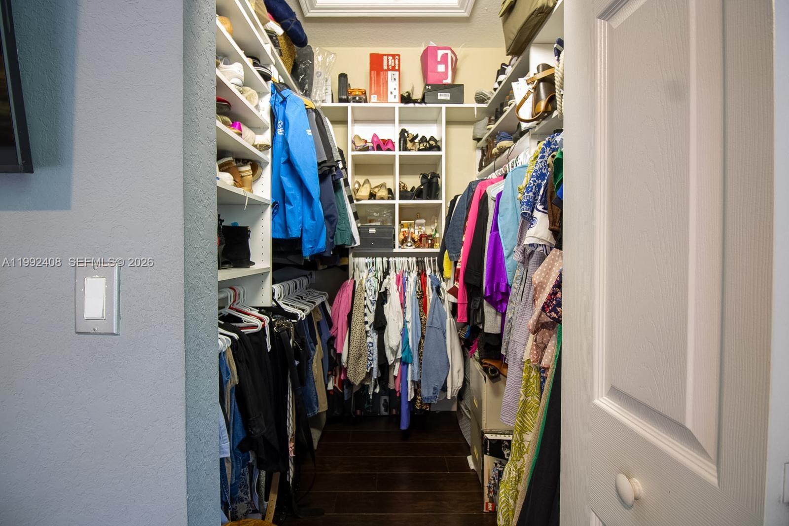 2607 Southwest 99th Way Miramar, FL 33025 - Photo 34 of 50 a view of walk in closet with clothes