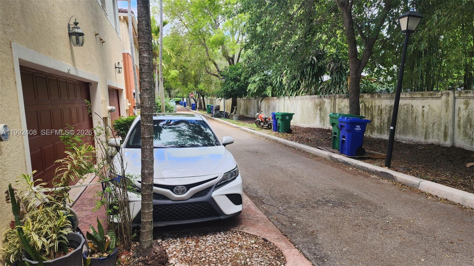 2607 Southwest 99th Way Miramar, FL 33025 - Photo 42 of 50 a backyard of a house with barbeque oven and outdoor seating