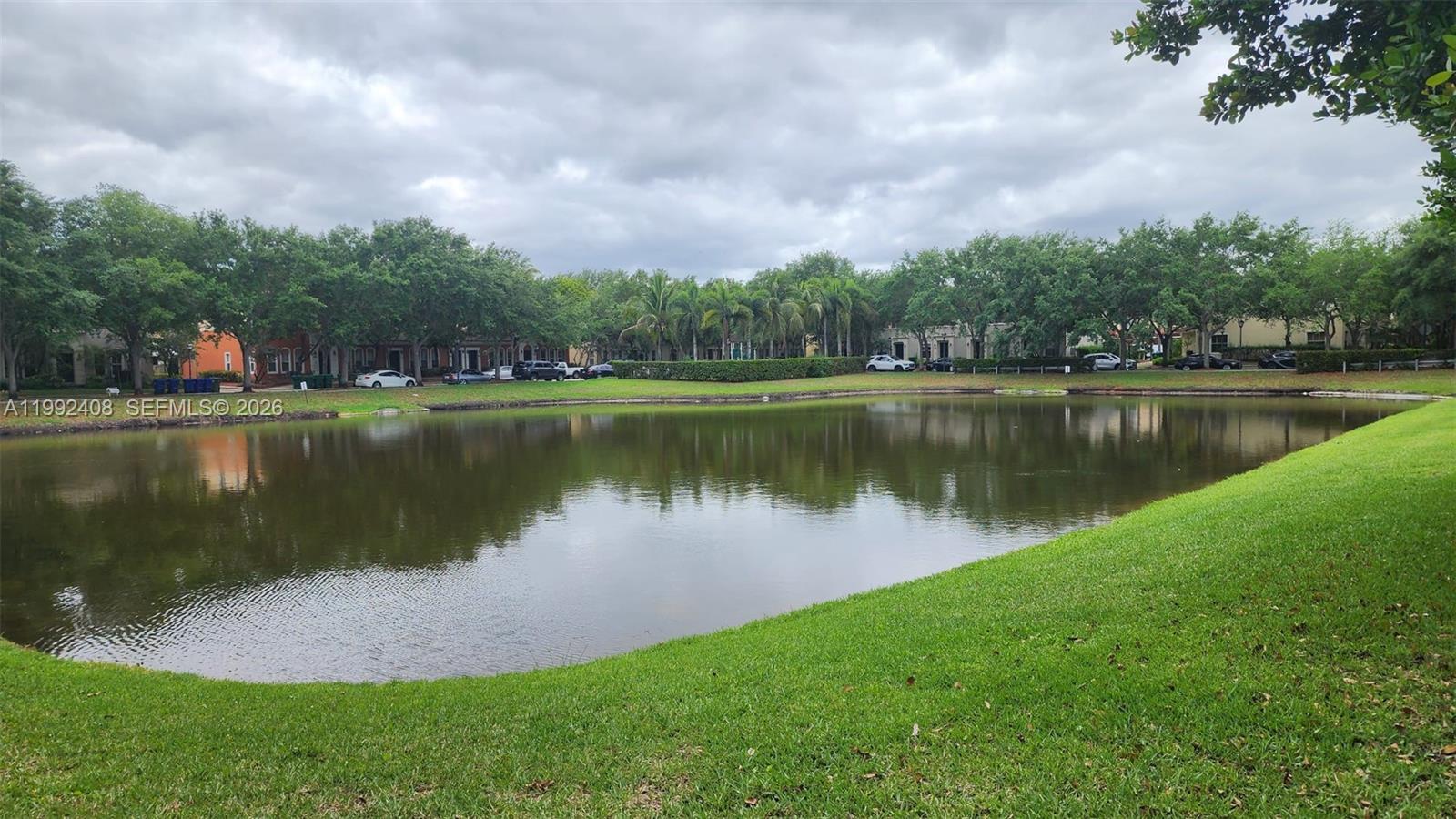2607 Southwest 99th Way Miramar, FL 33025 - Photo 44 of 50 a view of a lake with a house in the background