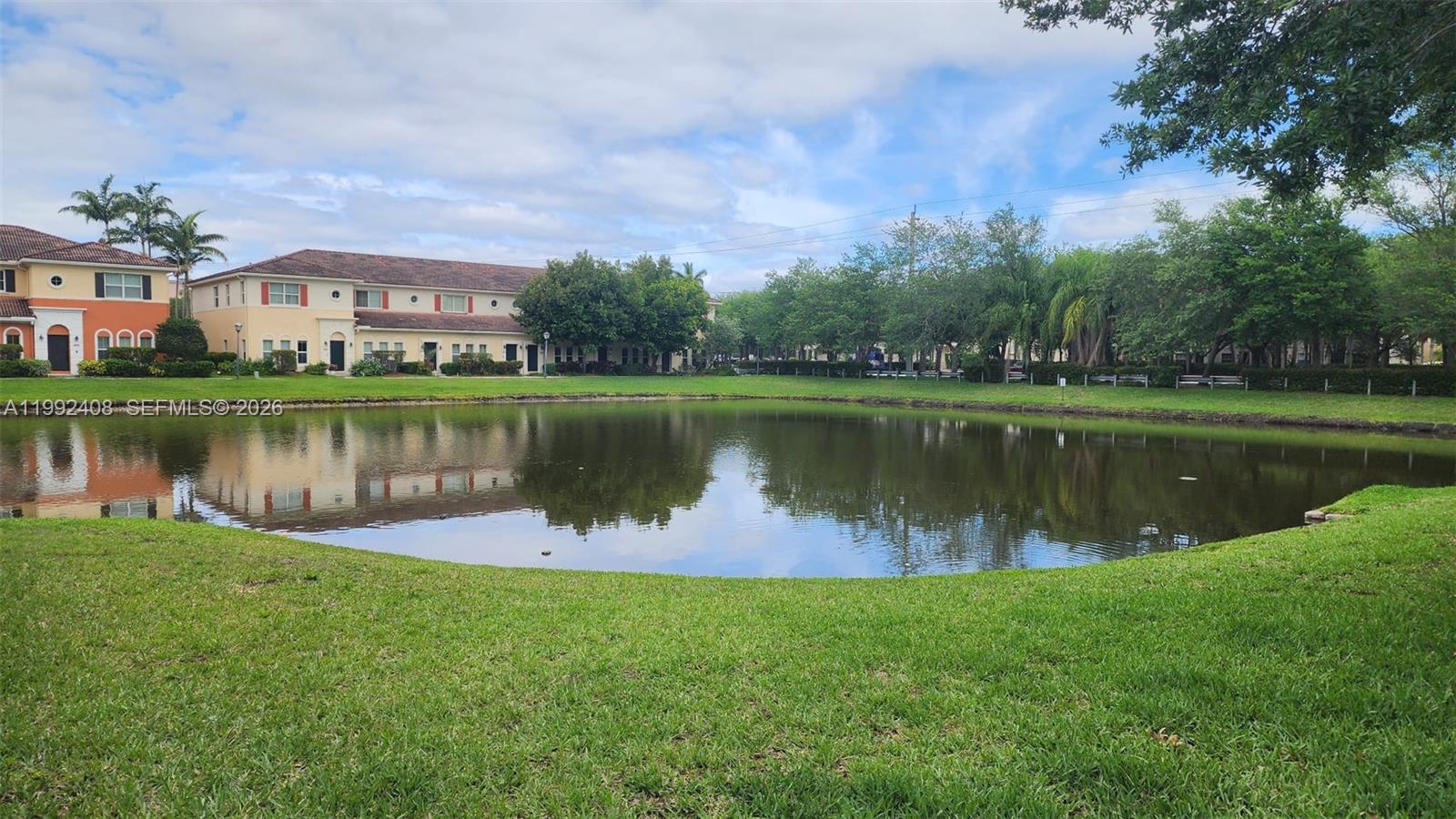 2607 Southwest 99th Way Miramar, FL 33025 - Photo 45 of 50 a view of a lake with houses in the background