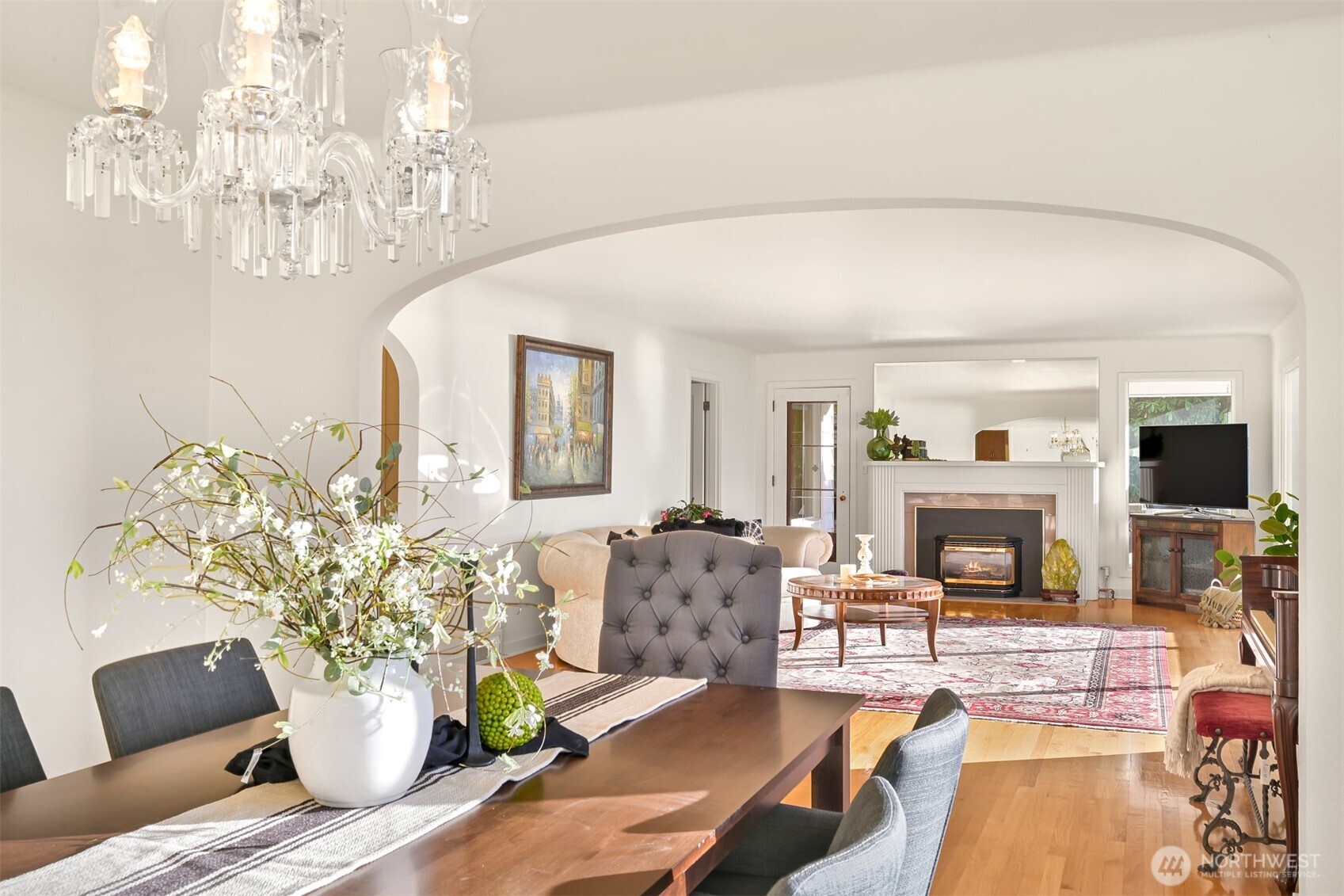 100 Willow Road Bellingham, WA 98225 - Photo 11 of 40 a living room with furniture a fireplace and a chandelier