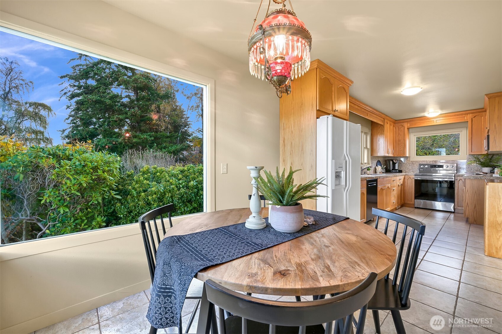 100 Willow Road Bellingham, WA 98225 - Photo 20 of 40 a view of a dining room with furniture window and wooden floor