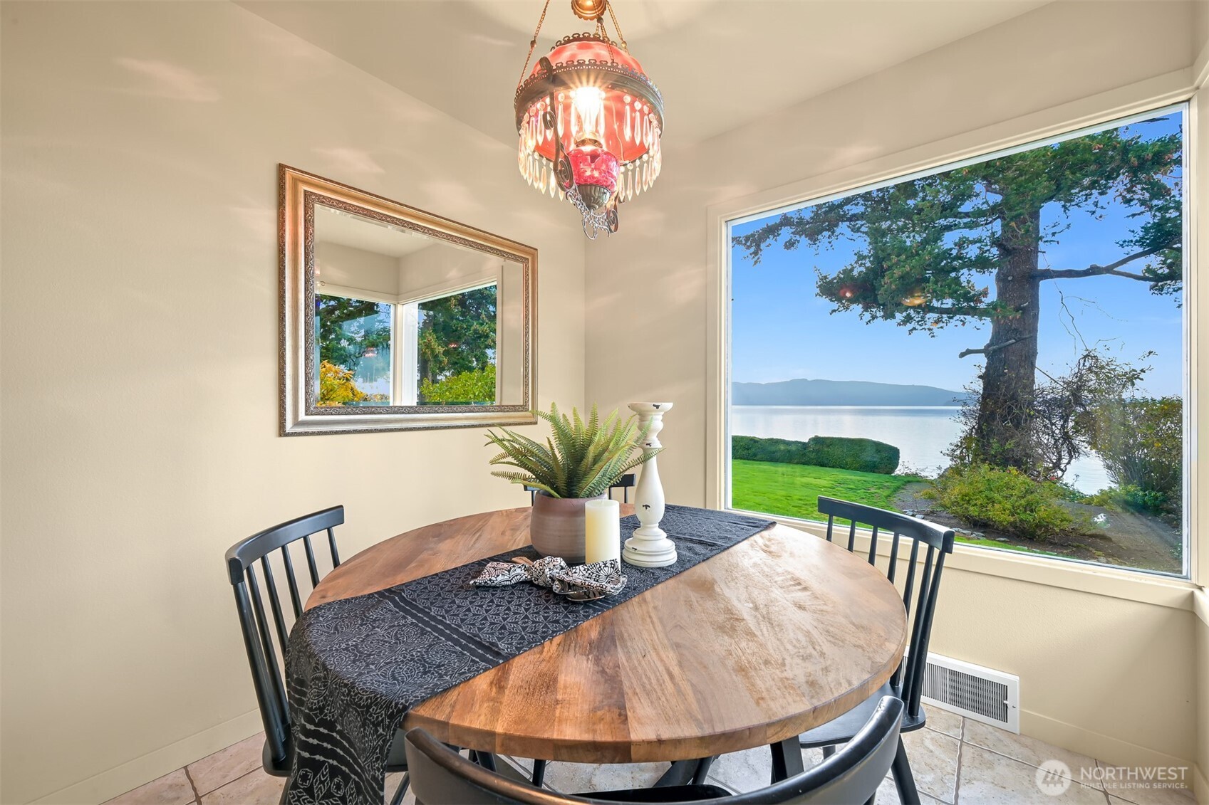 100 Willow Road Bellingham, WA 98225 - Photo 21 of 40 a view of a dining room with furniture a chandelier and wooden floor