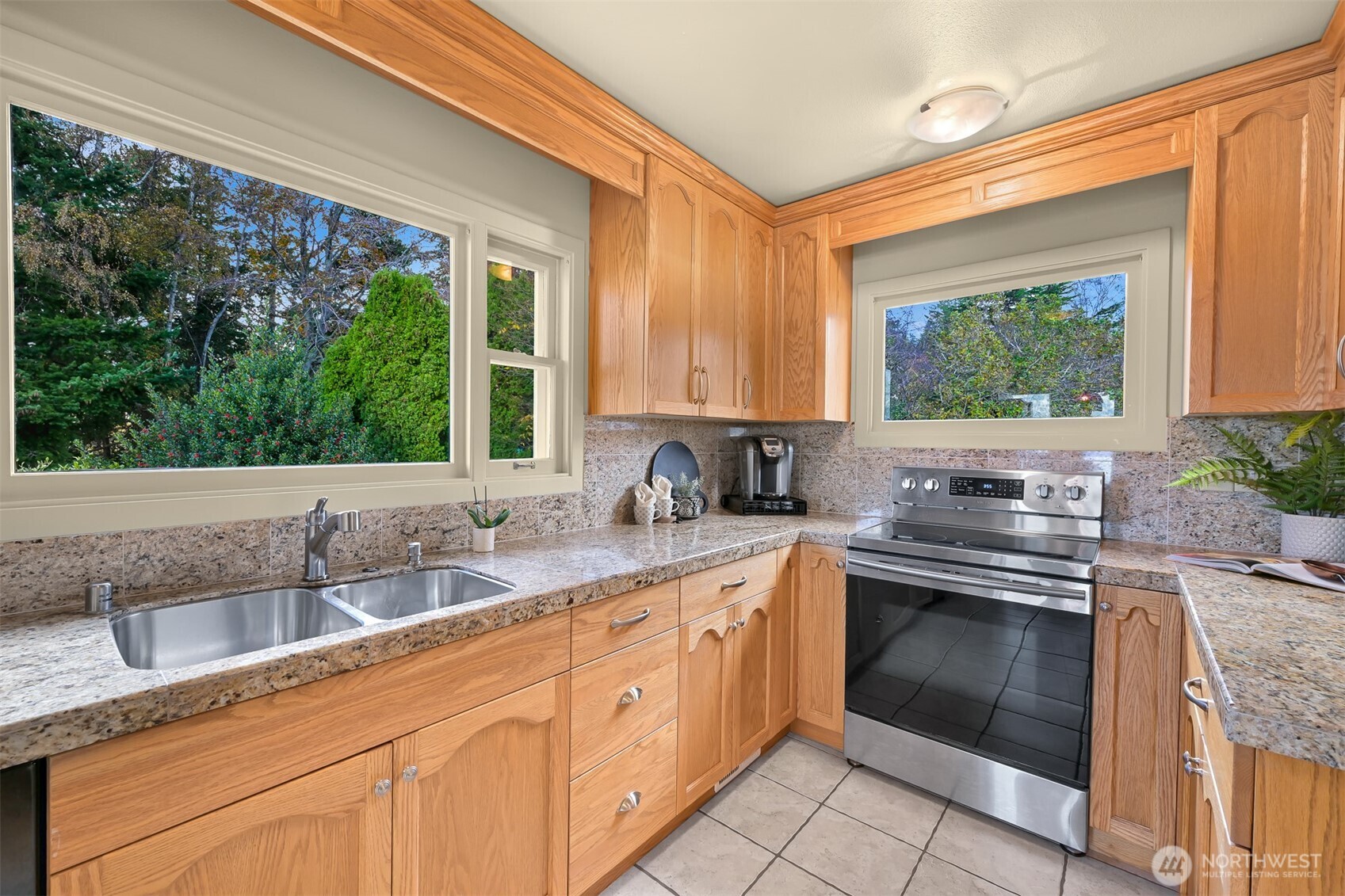 100 Willow Road Bellingham, WA 98225 - Photo 23 of 40 a kitchen with stainless steel appliances granite countertop a sink and cabinets