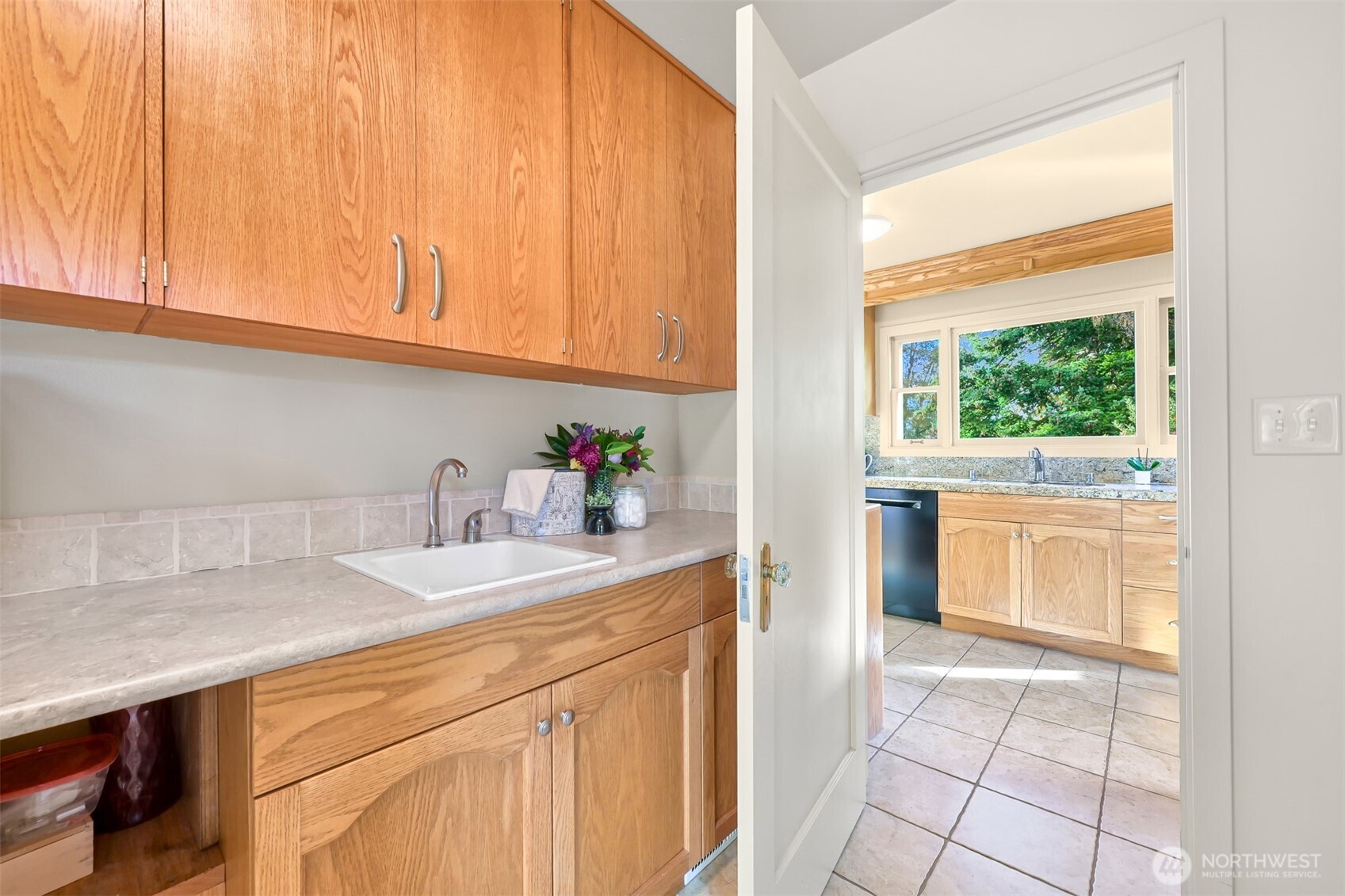 100 Willow Road Bellingham, WA 98225 - Photo 24 of 40 a kitchen with a sink cabinets and a window