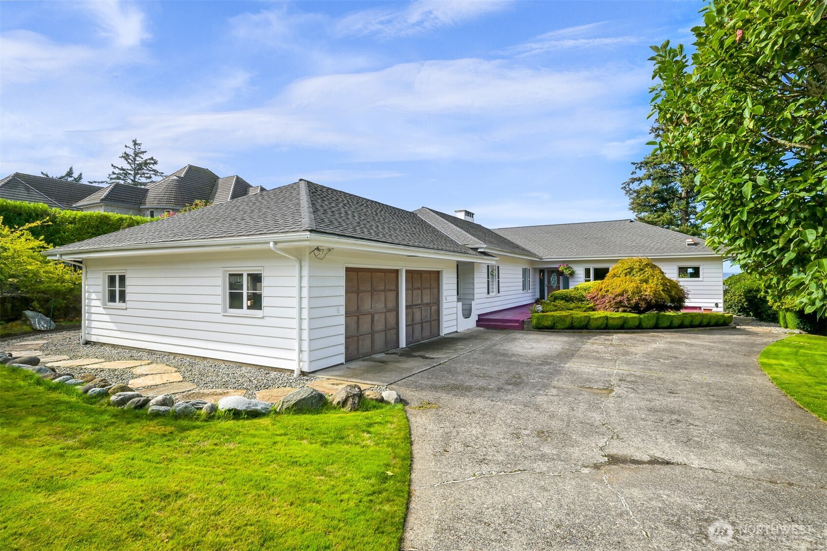 100 Willow Road Bellingham, WA 98225 - Photo 5 of 40 a front view of a house with a yard and garage