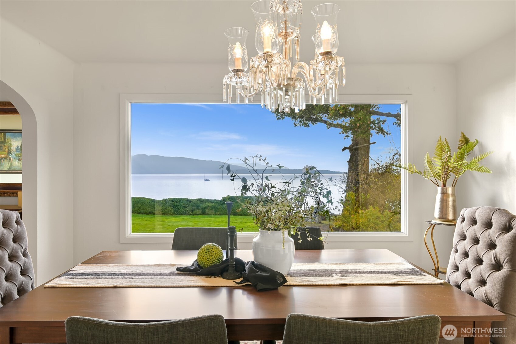 100 Willow Road Bellingham, WA 98225 - Photo 9 of 40 a view of a dining room with furniture a chandelier and large windows