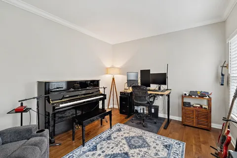 a view of a livingroom with furniture and a flat screen tv
