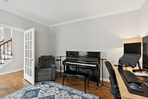 a livingroom with furniture and a workspace