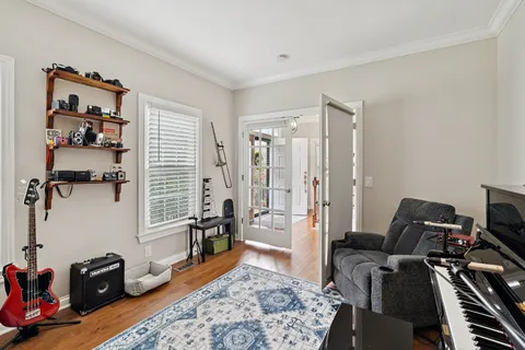 a room with furniture a rug and a wooden floor