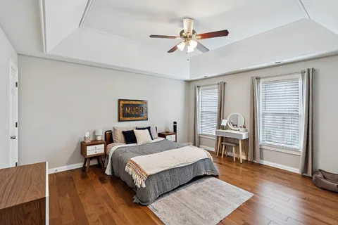 a bedroom with a bed and a table in it