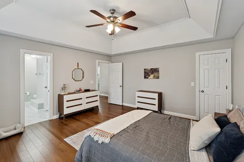a bedroom with furniture and a window