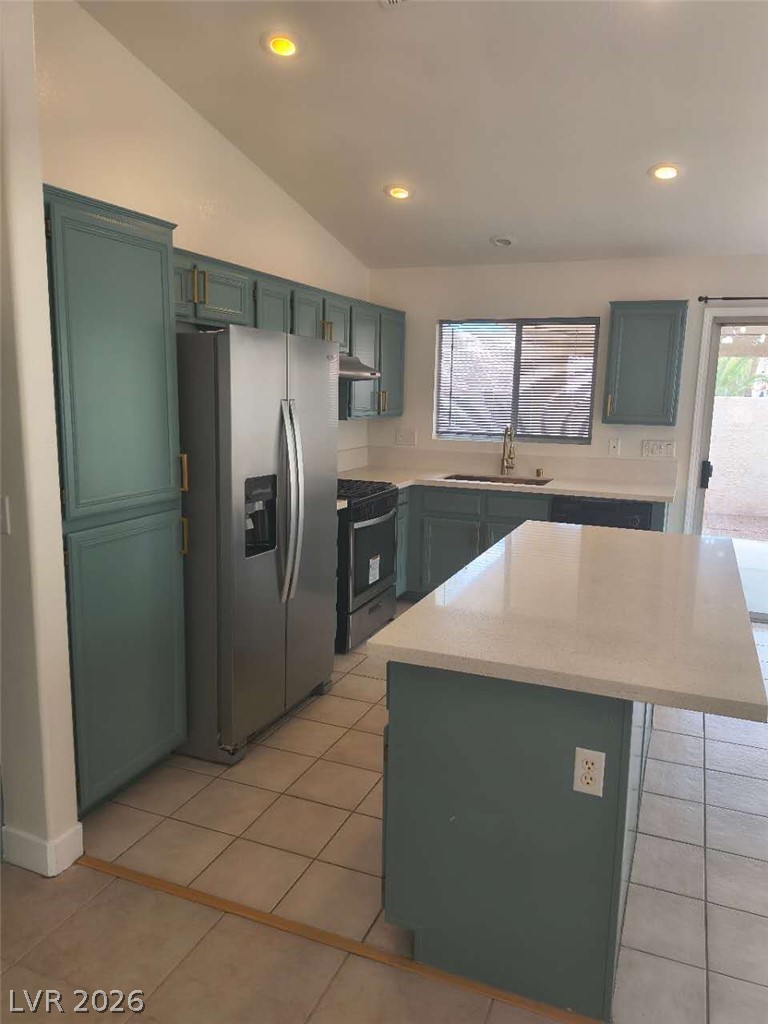 9725 Pima Point Avenue Las Vegas, NV 89147 - Photo 7 of 35 A well-equipped kitchen features a central island, recessed lighting, and ample cabinetry for storage.