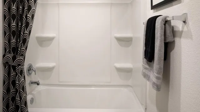 a bathroom with a shower and toilet