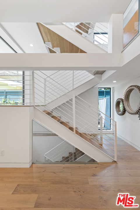 1620 Electric Avenue Venice, CA 90291 - Photo 16 of 31 a view of a hallway with stairs and a chandelier