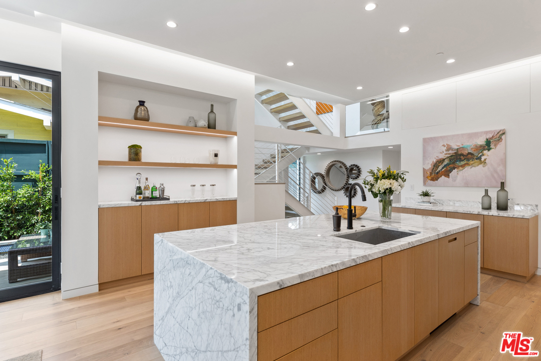 1620 Electric Avenue Venice, CA 90291 - Photo 6 of 31 a kitchen with stainless steel appliances granite countertop a sink dishwasher and a stove with wooden floor
